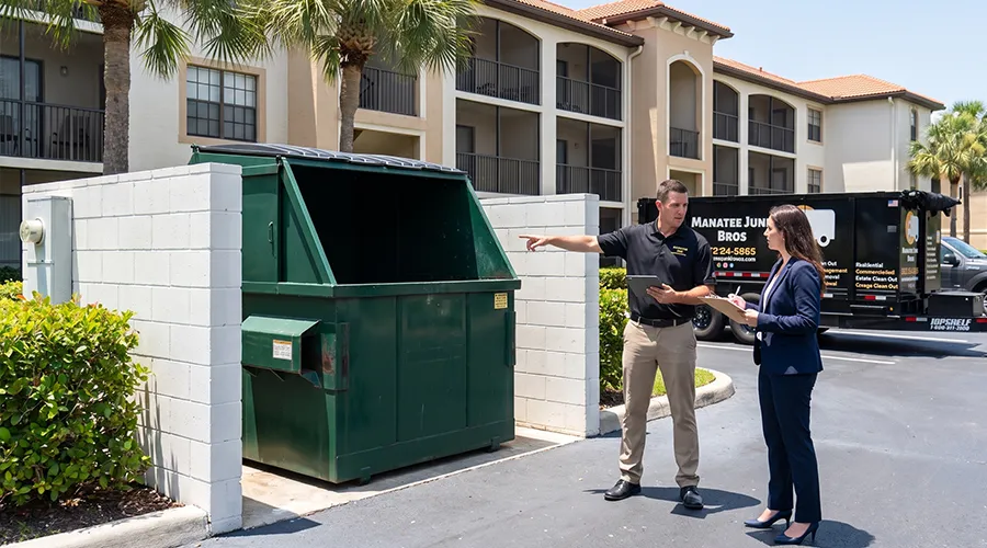Manatee Junk Bros owner Andrew coordinating a recurring commercial account at a Bradenton apartment complex